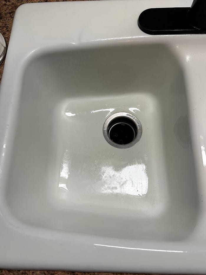 The kitchen sink, emptied and scrubbed.