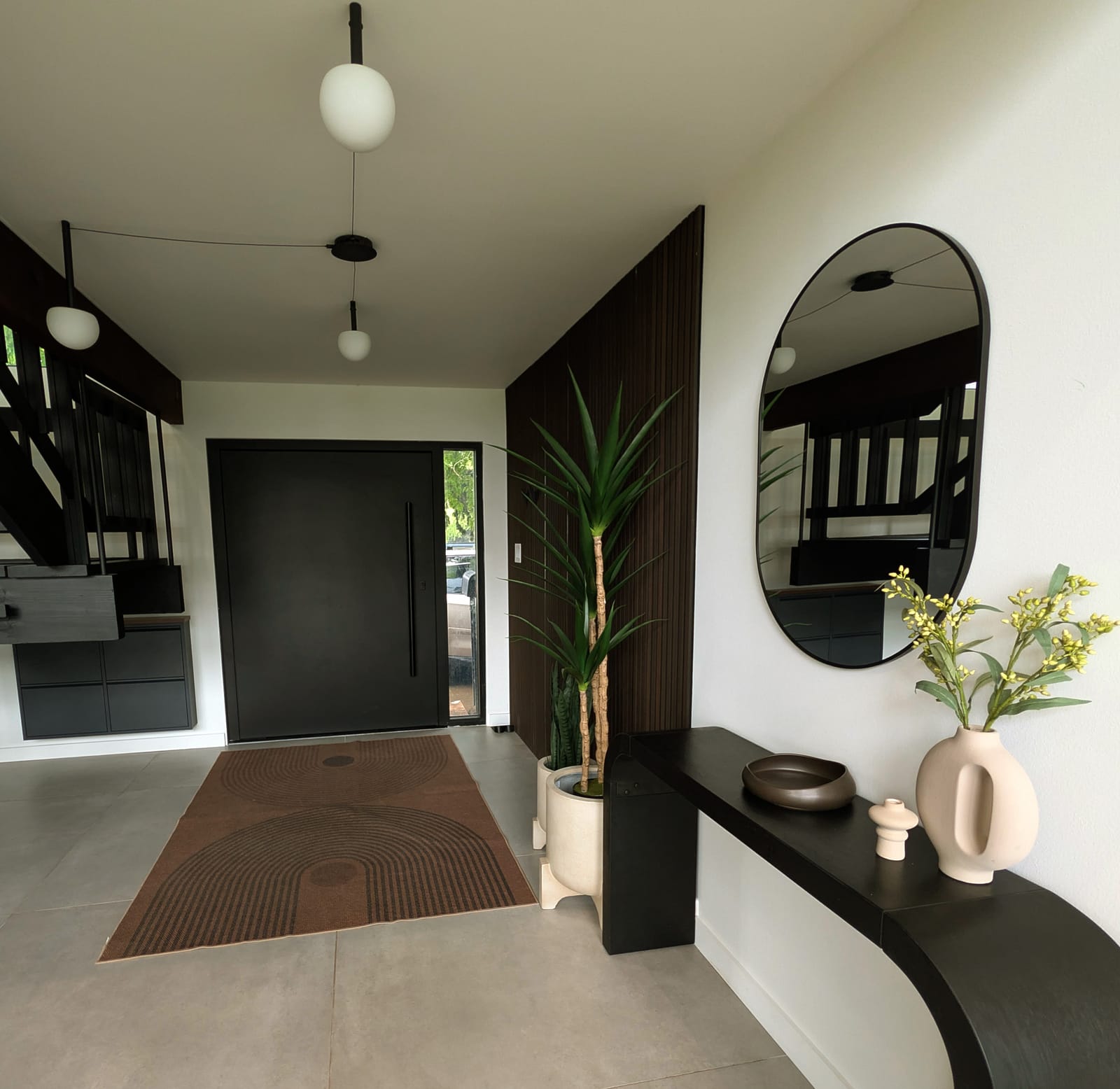 An entryway after a clean: mirror, floor and console all clear.