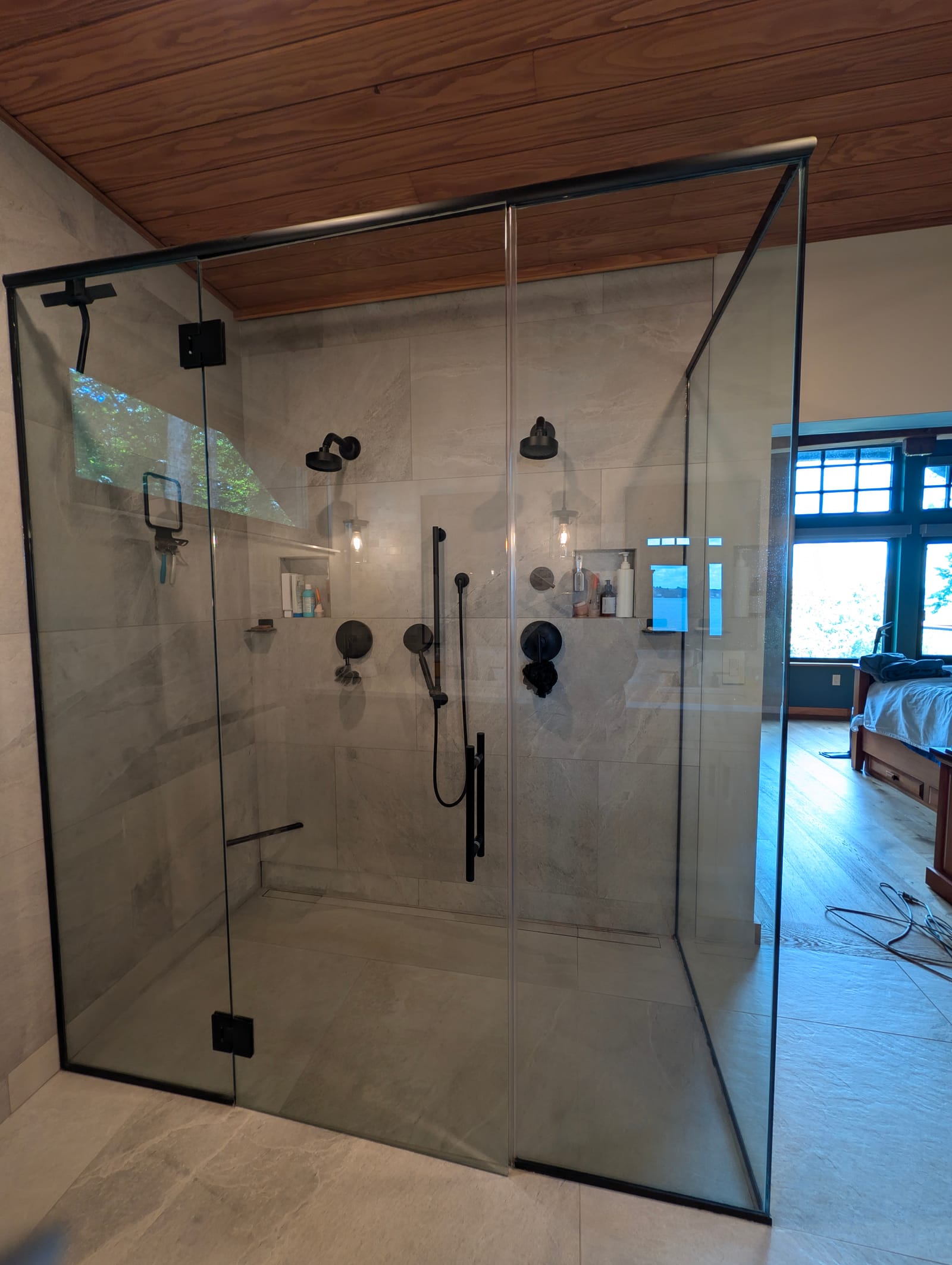 A glass shower enclosure, wiped clear of every mark.